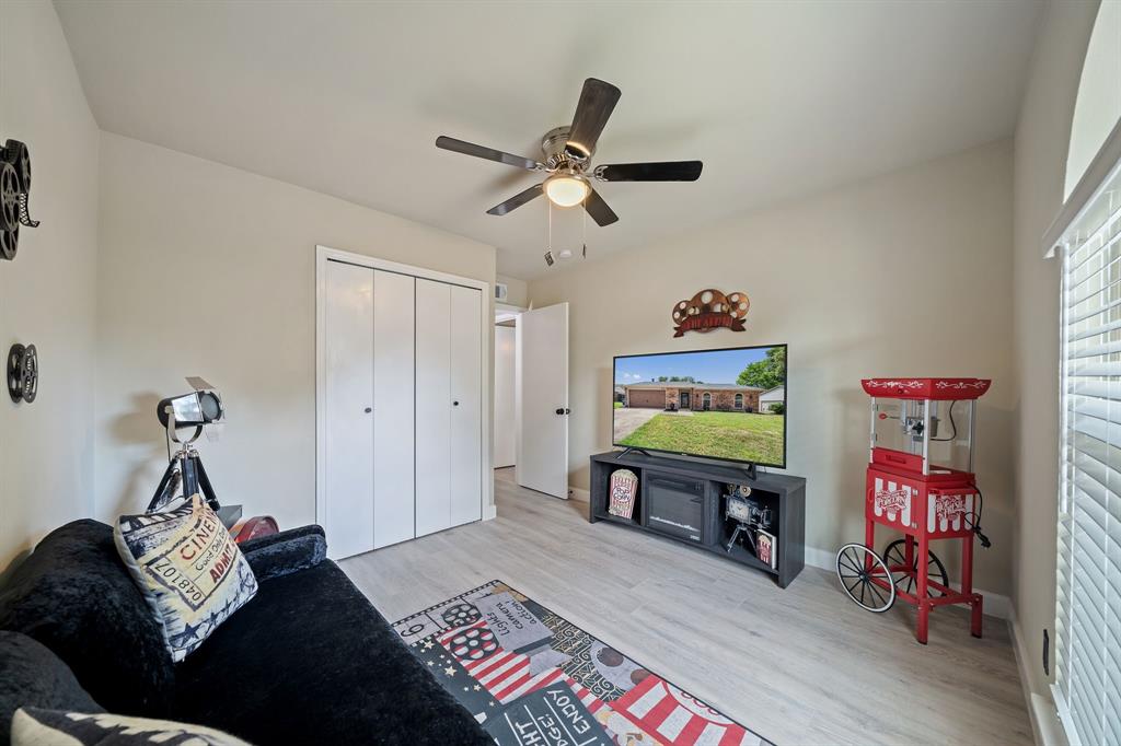 622 Roaming Rd Drive Allen, TX 75002 - Photo 20 of 27 a bedroom with furniture and a wooden floor