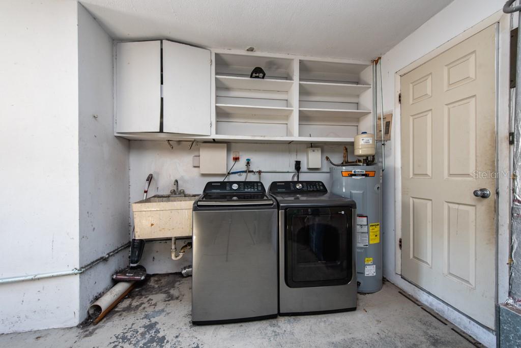 1877 Dawn Drive Clearwater, FL 33763 - Photo 21 of 36 a utility room with cabinets