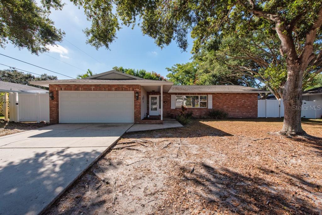 1877 Dawn Drive Clearwater, FL 33763 - Photo 28 of 36 a front view of house with yard