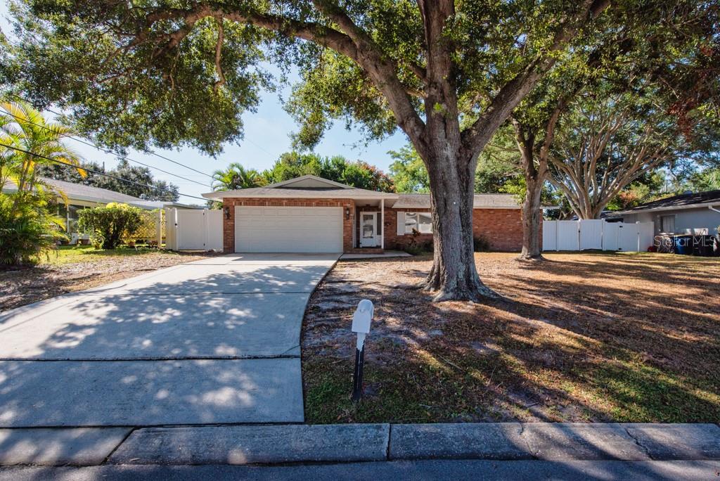 1877 Dawn Drive Clearwater, FL 33763 - Photo 29 of 36 a view of a yard with wooden fence