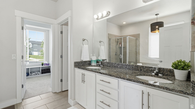 111 East Silver Oak Road Vineyard, UT 84059 - Photo 19 of 50 Double vanity with granite countertop, white cabinetry, and brushed nickel hardware