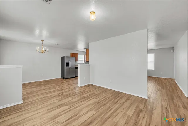 a view of a livingroom with wooden floor