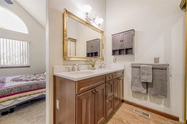 a en suite bathroom with a sink and a mirror