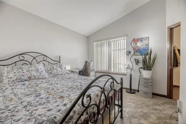 a bedroom with a bed and a view of bathroom