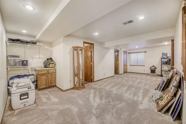 a view of a kitchen with furniture and a stove