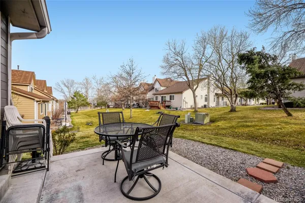 a view of a swimming pool with chair and table