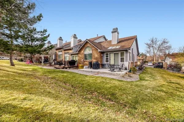 a front view of a building with swimming pool and porch