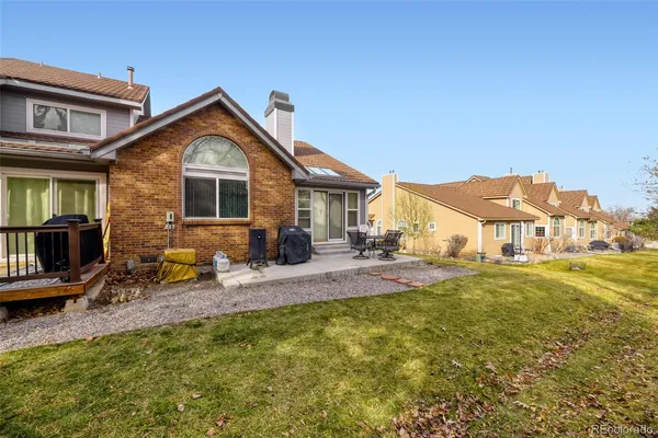 a front view of house with yard and seating area