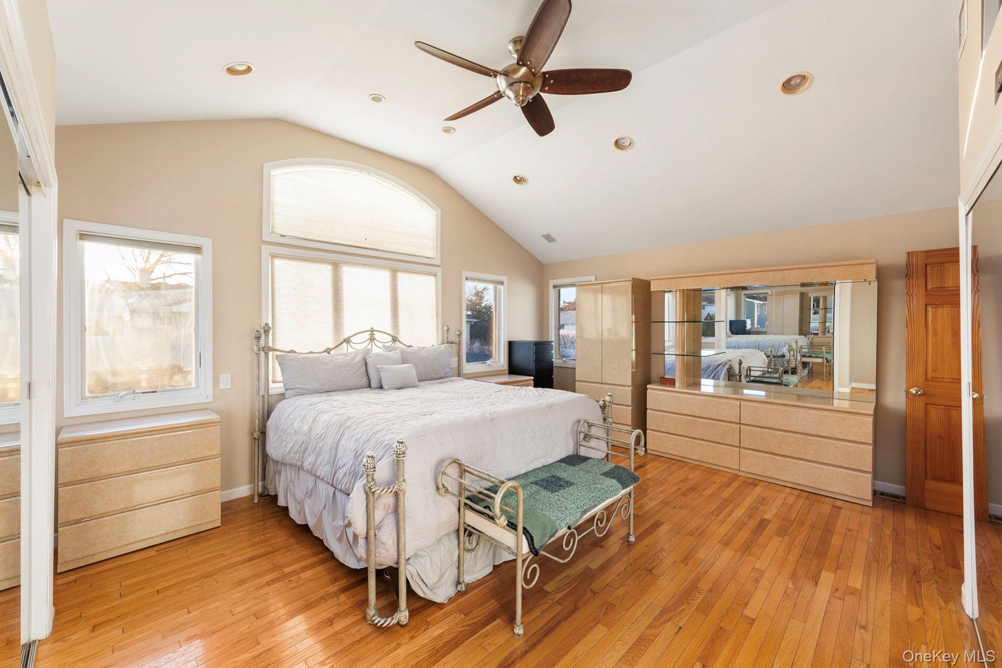 2770 Mandalay Beach Road Wantagh, NY 11793 - Photo 13 of 27 a spacious bedroom with a bed and a large window