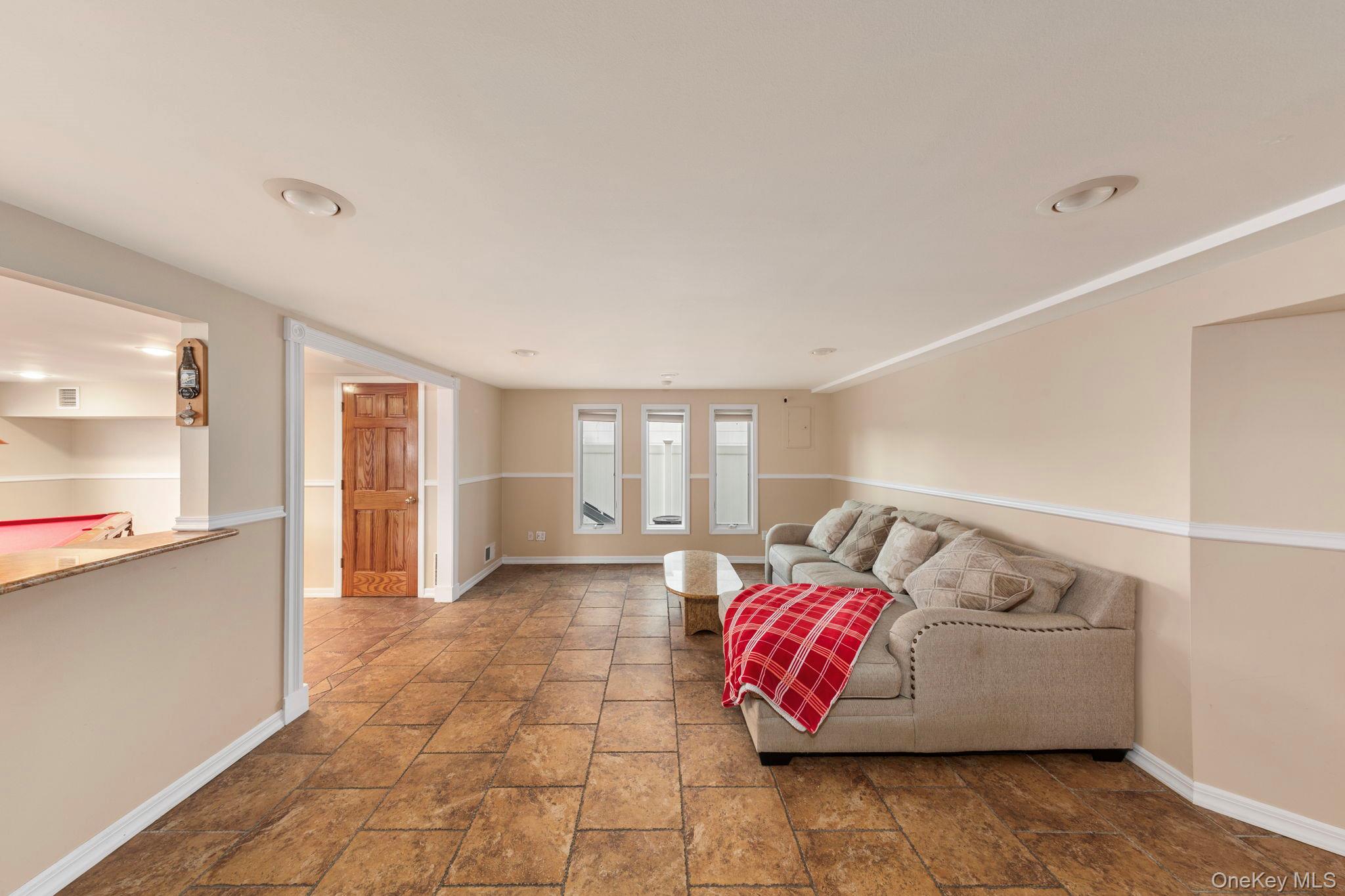 2770 Mandalay Beach Road Wantagh, NY 11793 - Photo 18 of 27 a bedroom with furniture and window