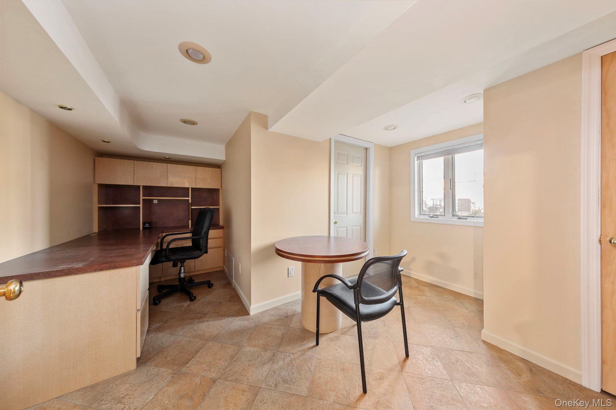 2770 Mandalay Beach Road Wantagh, NY 11793 - Photo 19 of 27 a view of a workspace with furniture and a window