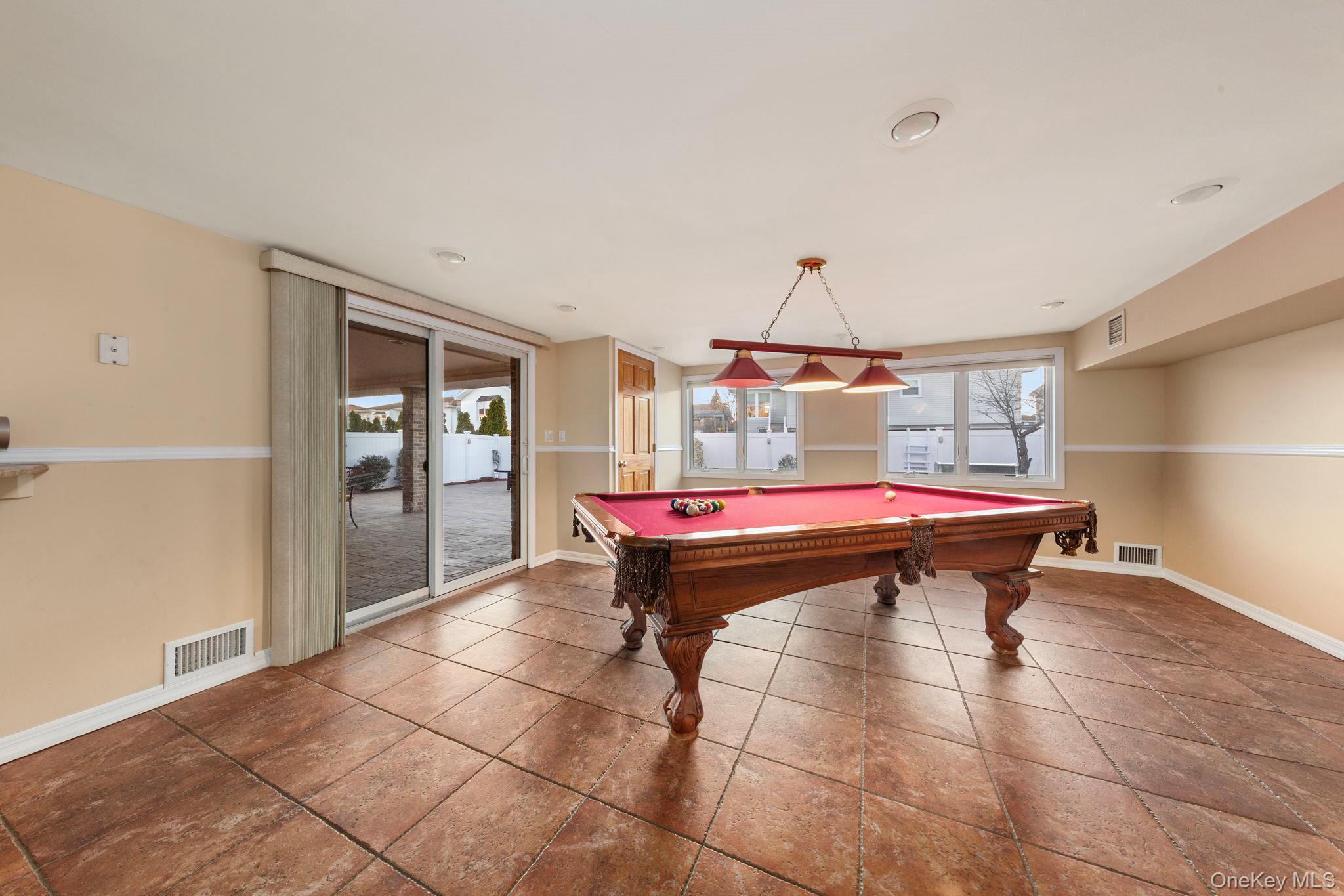 2770 Mandalay Beach Road Wantagh, NY 11793 - Photo 20 of 27 a room with furniture a rug and white walls