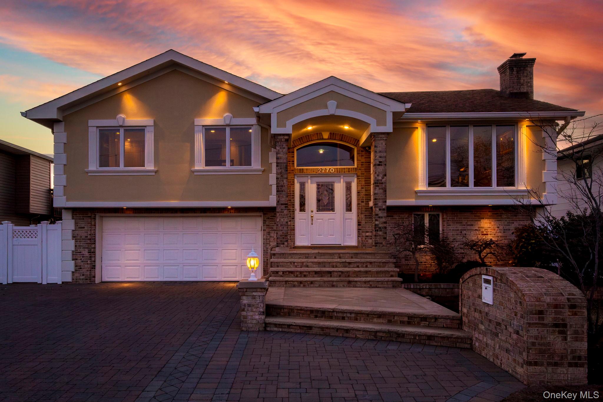 2770 Mandalay Beach Road Wantagh, NY 11793 - Photo 2 of 27 a front view of a house with a garden