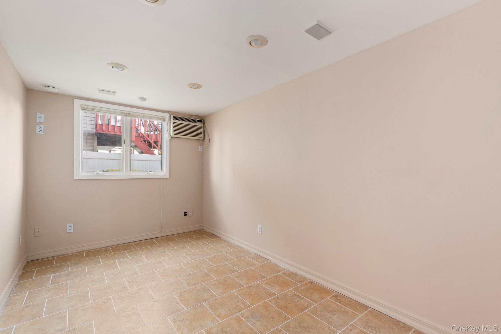 2770 Mandalay Beach Road Wantagh, NY 11793 - Photo 22 of 27 a view of an empty room with paintings on the wall