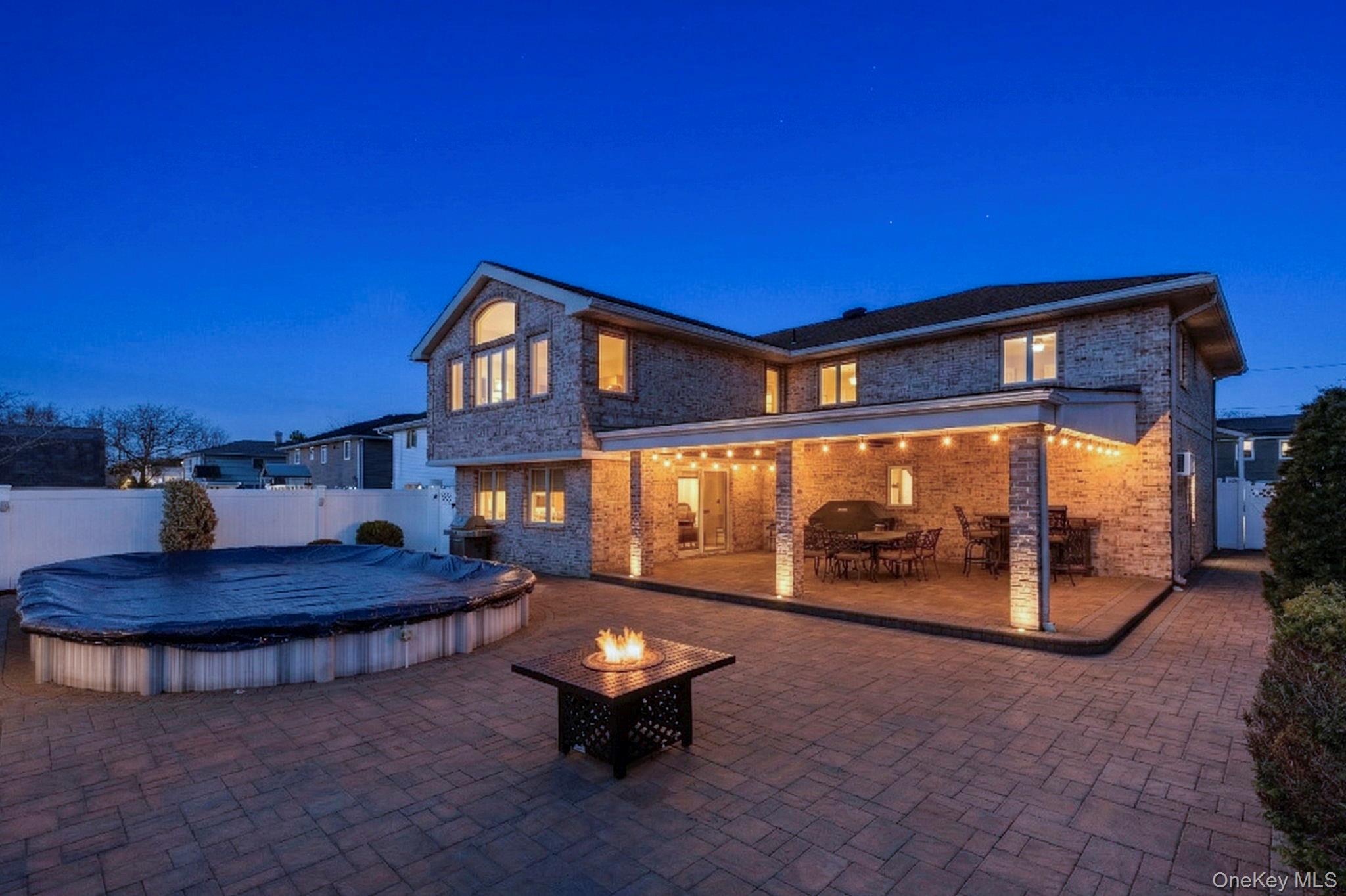 2770 Mandalay Beach Road Wantagh, NY 11793 - Photo 26 of 27 a view of a house with backyard and sitting area