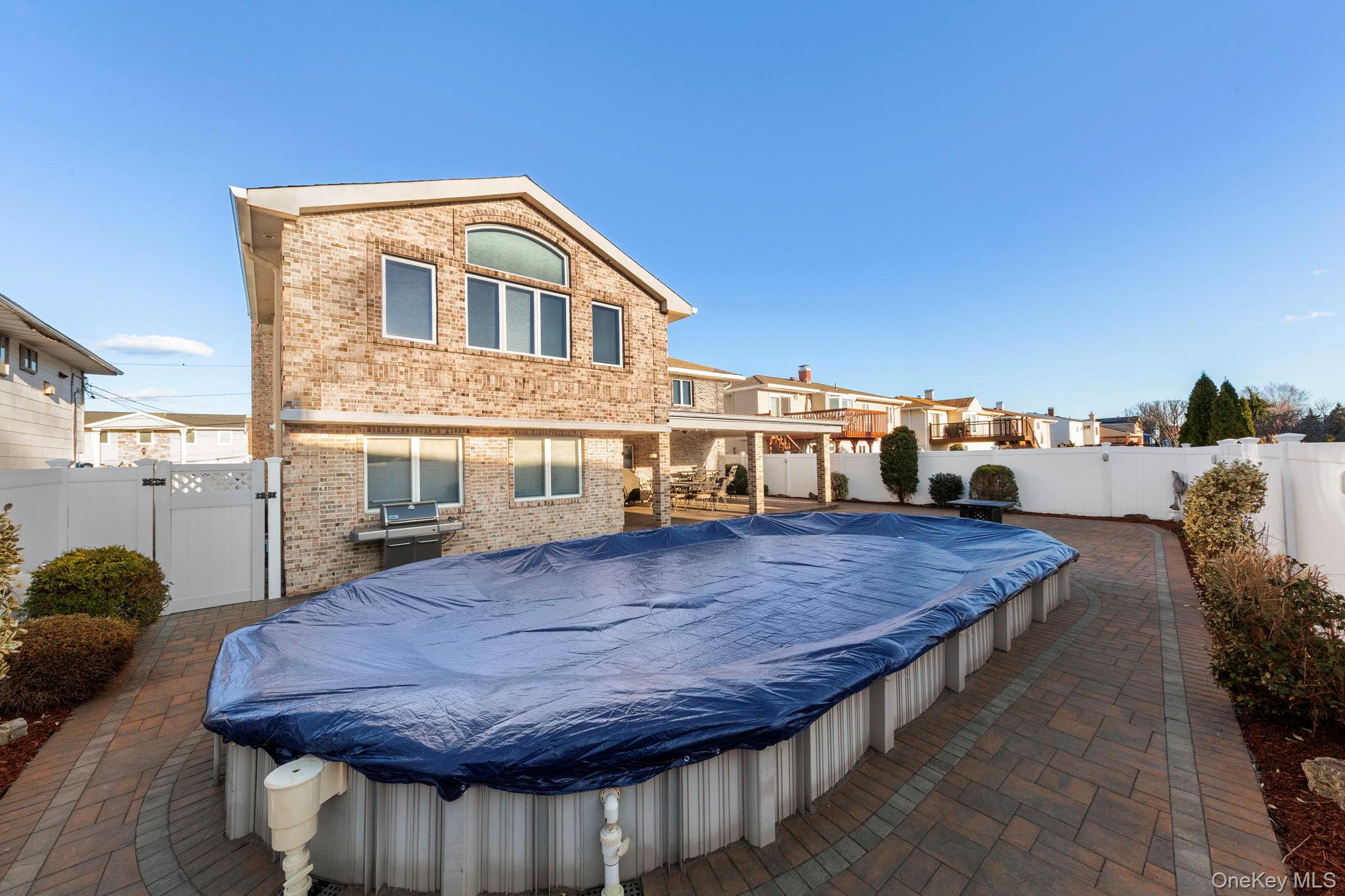 2770 Mandalay Beach Road Wantagh, NY 11793 - Photo 27 of 27 a living room with a table chairs and a wooden floor