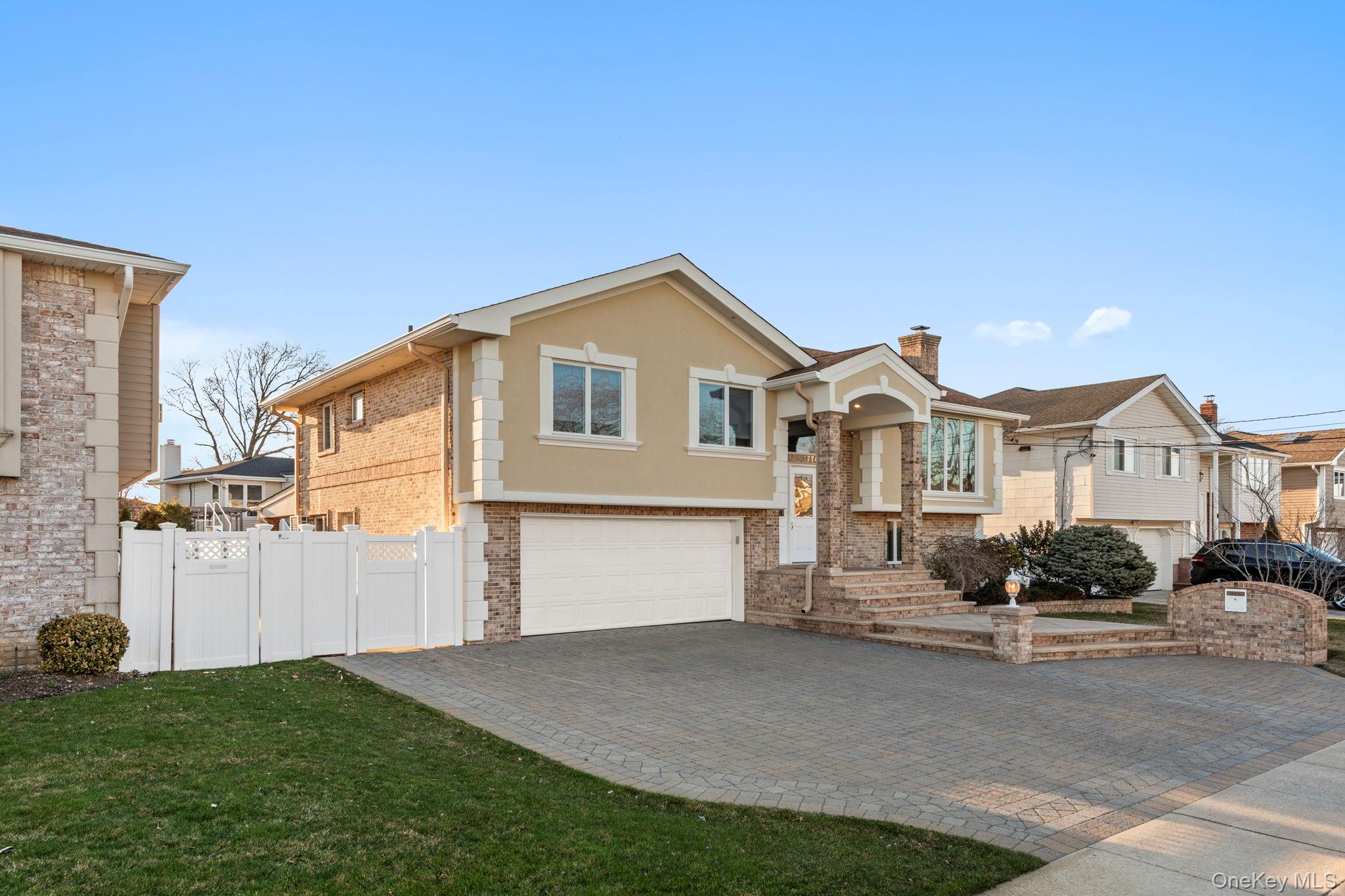2770 Mandalay Beach Road Wantagh, NY 11793 - Photo 3 of 27 a front view of a house with a yard