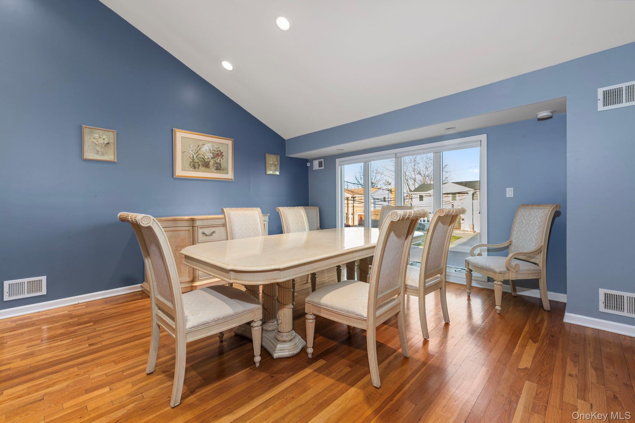 2770 Mandalay Beach Road Wantagh, NY 11793 - Photo 8 of 27 a view of a dining room with furniture window and wooden floor