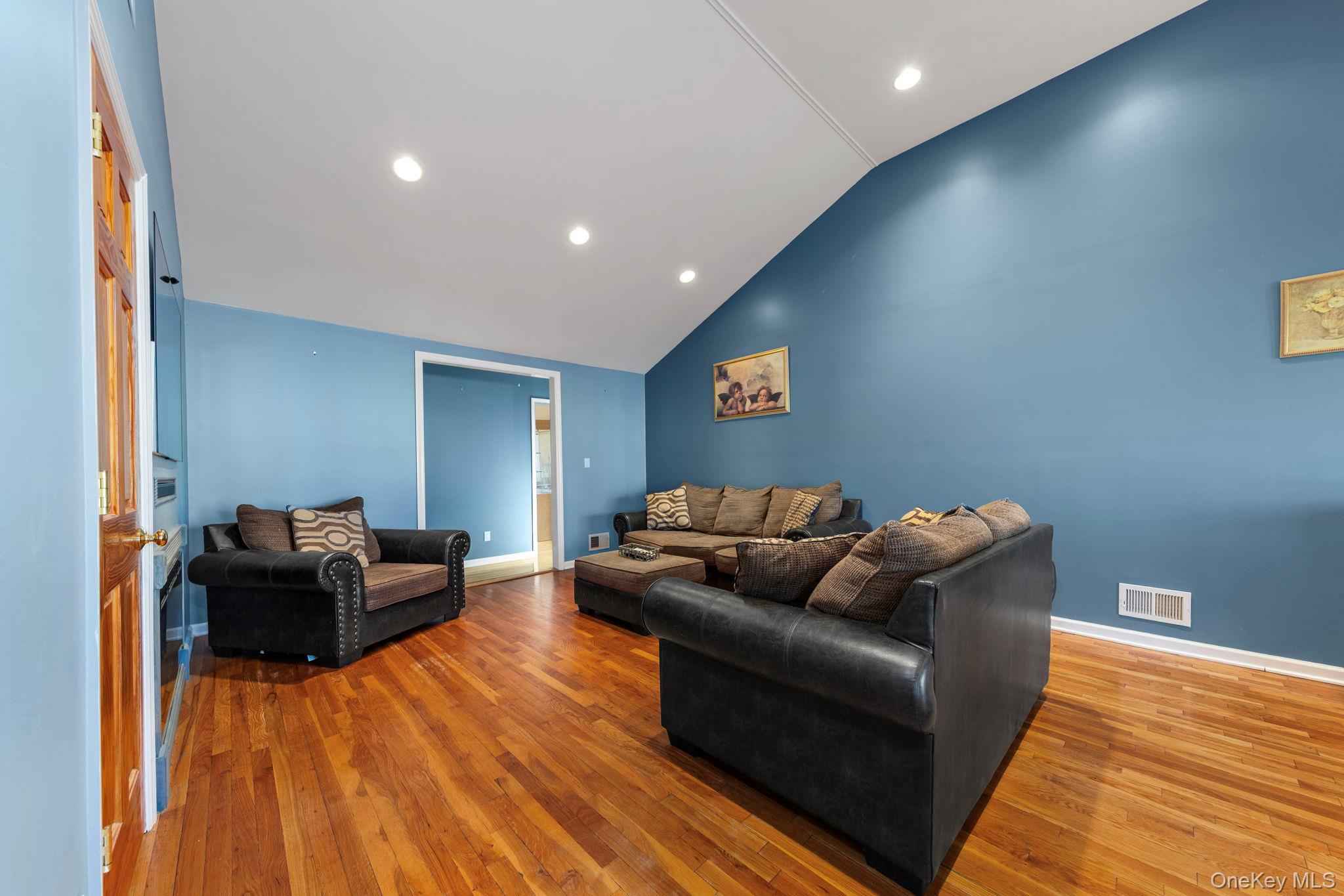 2770 Mandalay Beach Road Wantagh, NY 11793 - Photo 9 of 27 a living room with furniture and a wooden floor