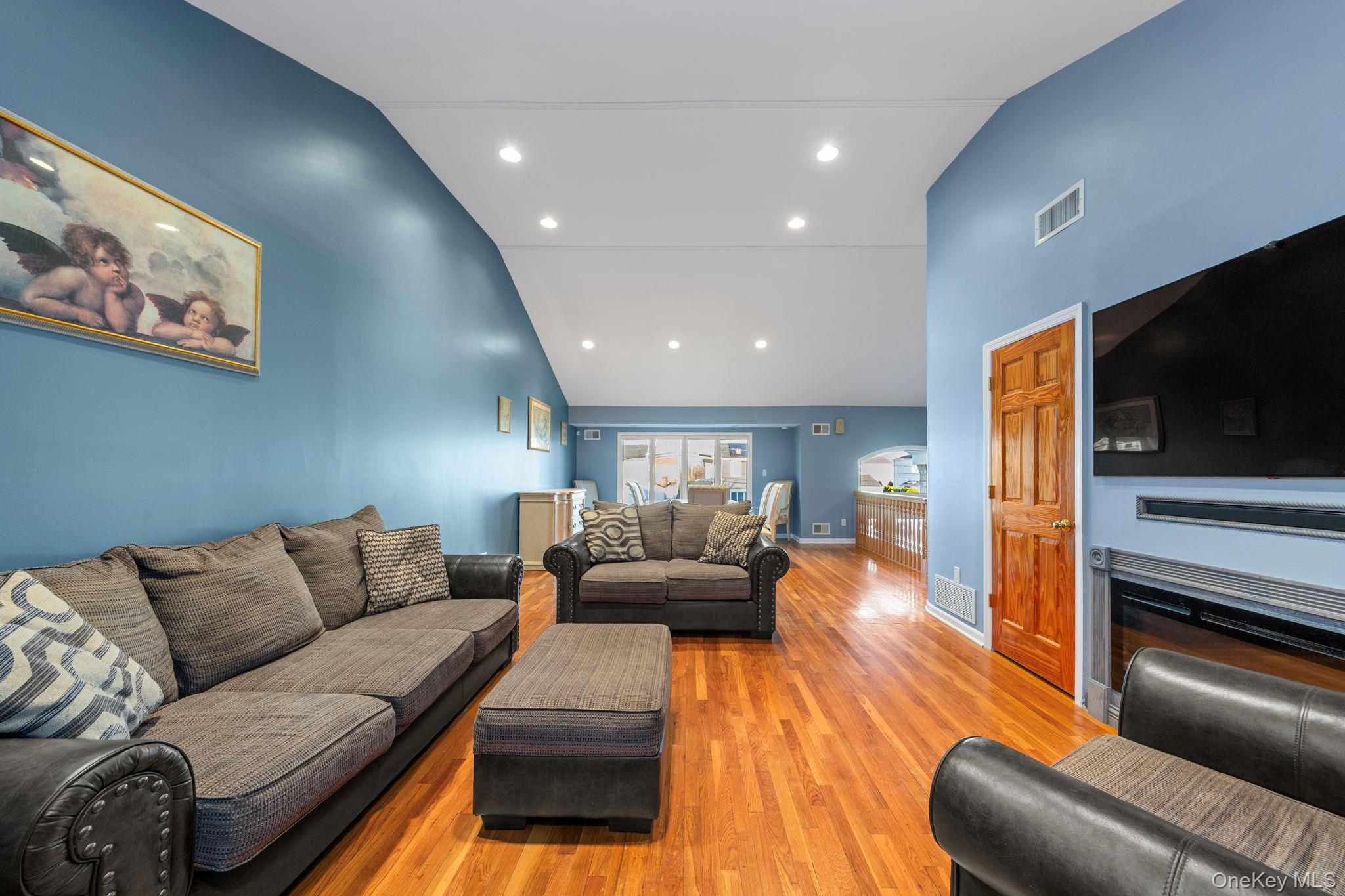2770 Mandalay Beach Road Wantagh, NY 11793 - Photo 10 of 27 a living room with furniture and a flat screen tv