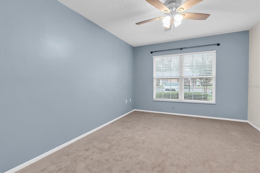 4814 Grist Mill Circle New Port Richey, FL 34655 - Photo 19 of 63 a view of an empty room with a window
