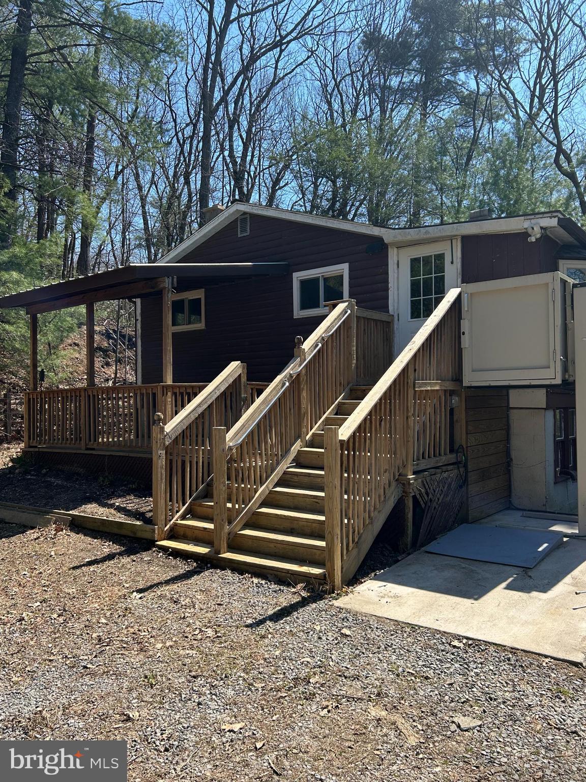 923 Dever Hollow Road Millerstown, PA 17062 - Photo 2 of 12 a view of house with wooden fence and a trees