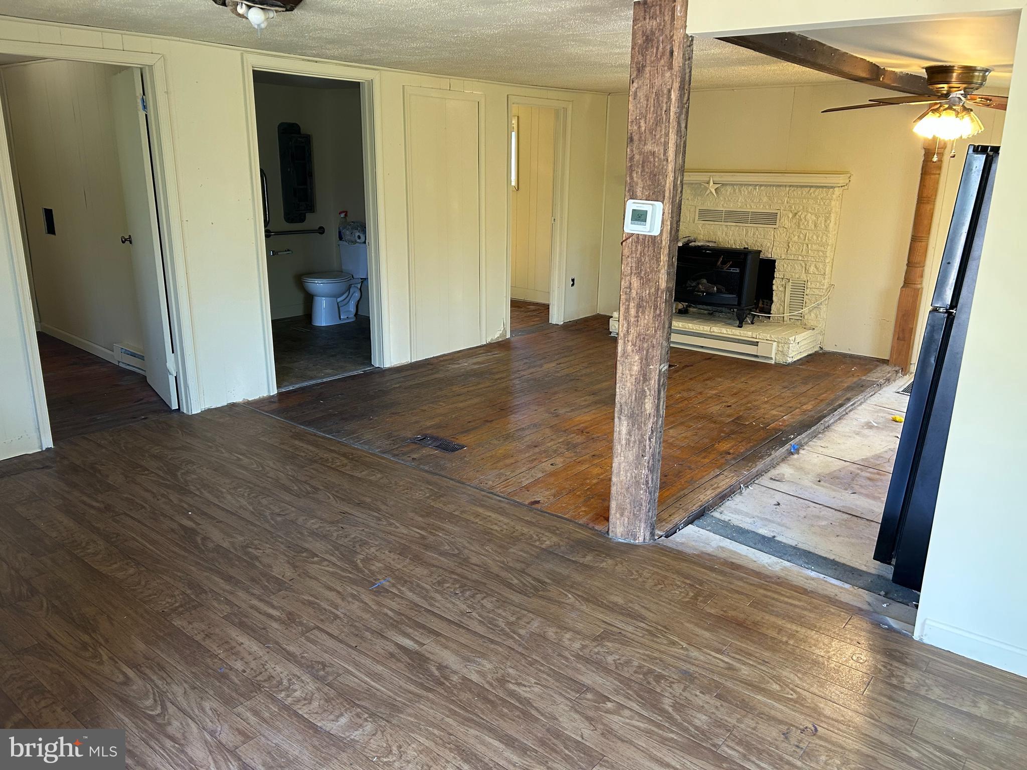 923 Dever Hollow Road Millerstown, PA 17062 - Photo 3 of 12 a view of a hallway view with wooden floor and staircase