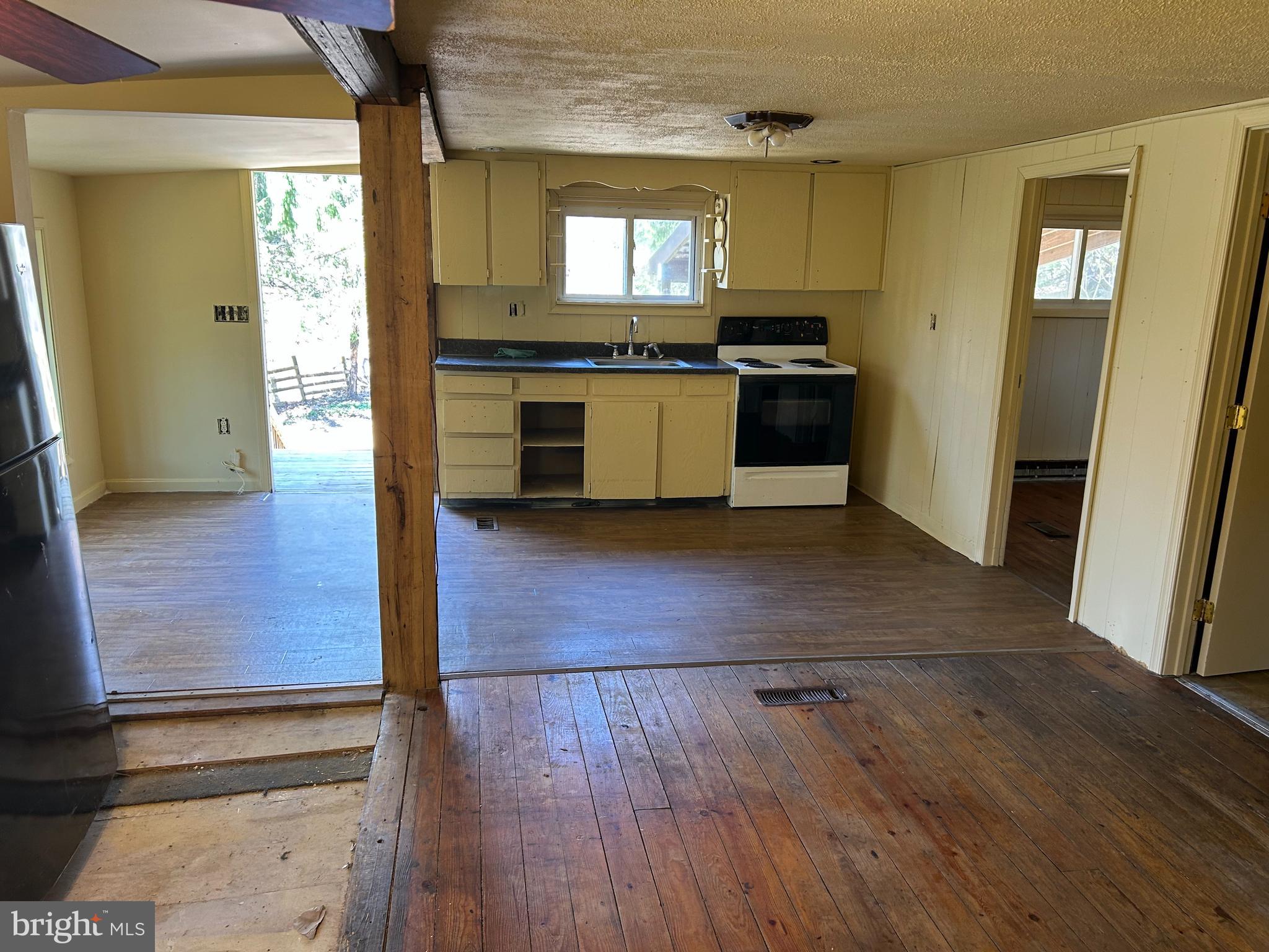 923 Dever Hollow Road Millerstown, PA 17062 - Photo 4 of 12 a kitchen with granite countertop wooden floors and stainless steel appliances