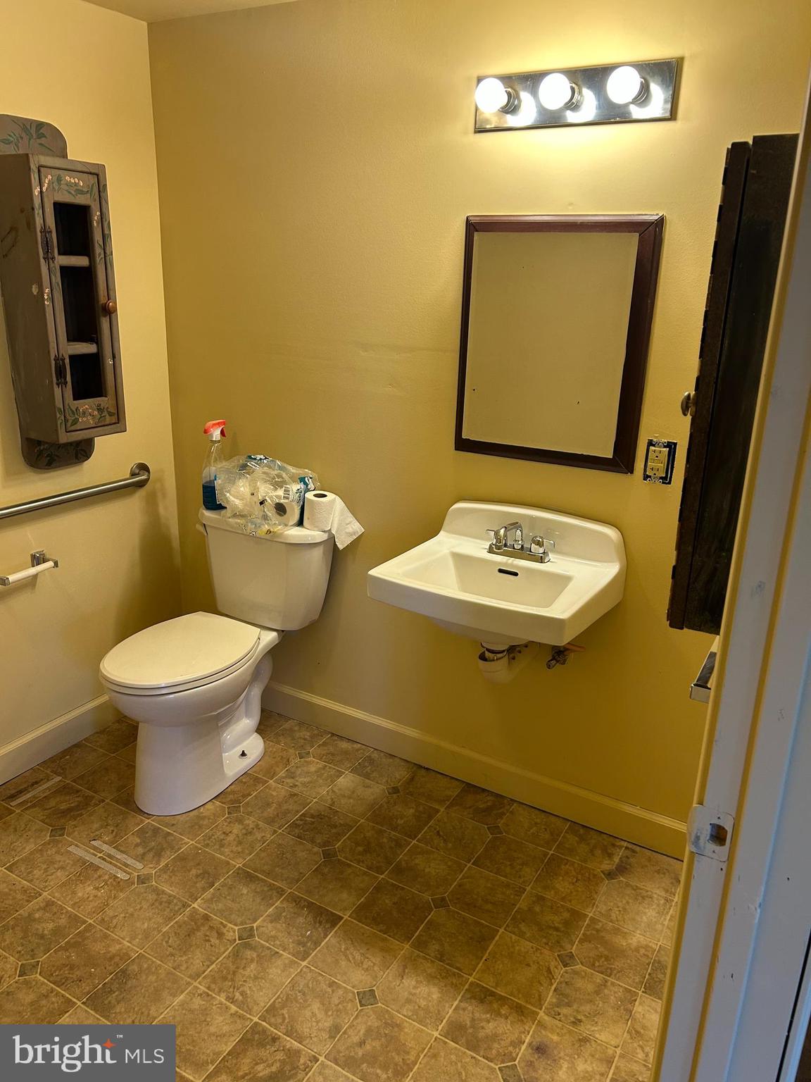 923 Dever Hollow Road Millerstown, PA 17062 - Photo 5 of 12 a bathroom with a toilet sink and mirror