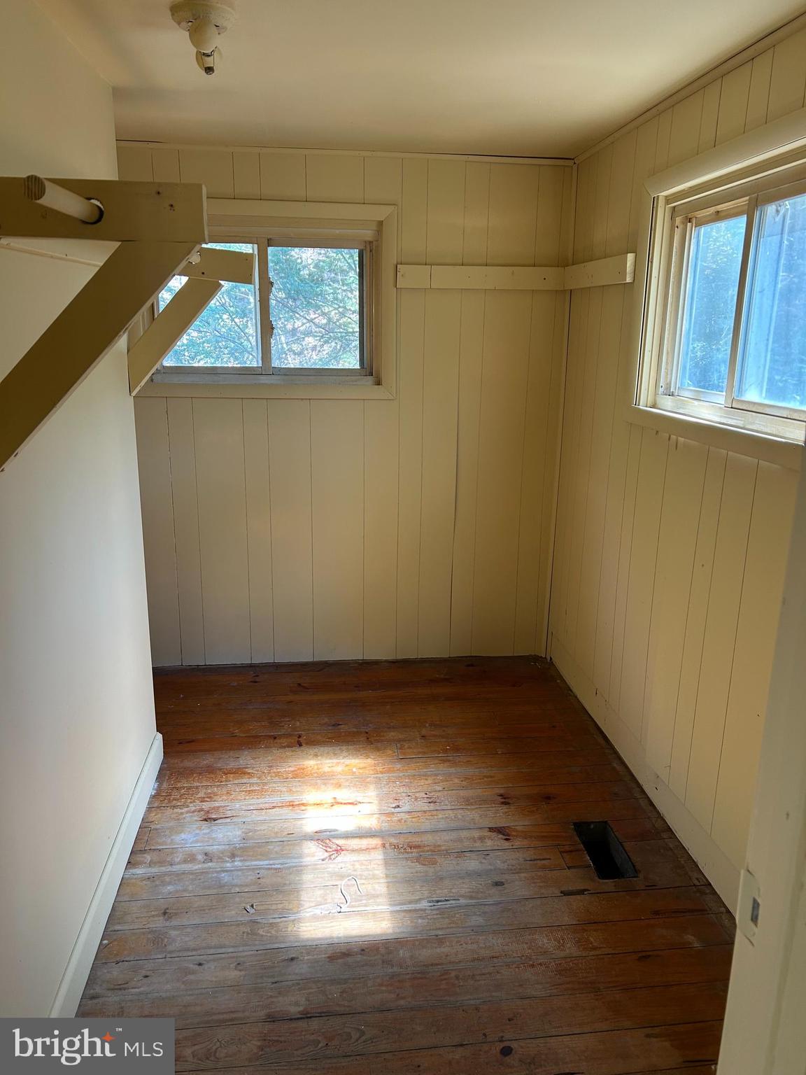 923 Dever Hollow Road Millerstown, PA 17062 - Photo 8 of 12 an empty room with wooden floor and windows