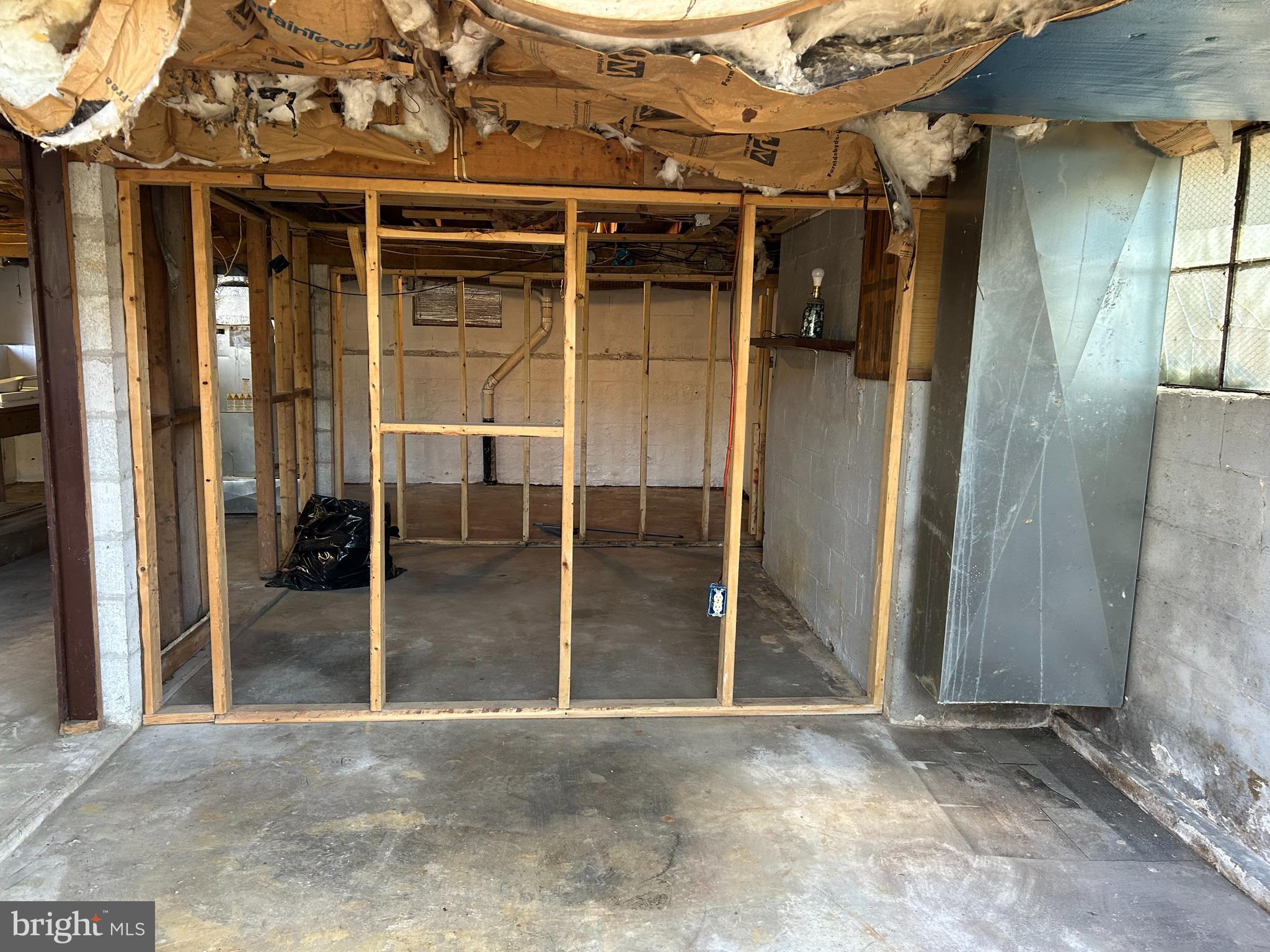923 Dever Hollow Road Millerstown, PA 17062 - Photo 9 of 12 an empty room with wooden floor and door