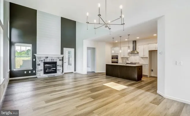 a view of kitchen with sink microwave and refrigerator