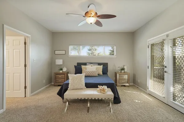 a bedroom with a bed and a chandelier