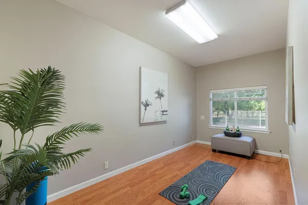 a bedroom with furniture and a window