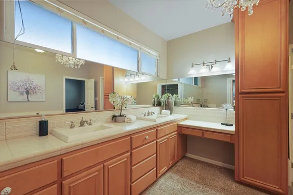 a bathroom with a sink double vanity and a mirror
