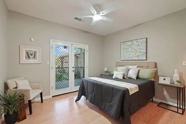 a bedroom with a large bed and a window