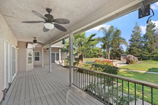 a view of a porch with wooden floor and deck