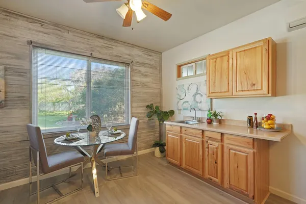 a dining room with furniture and window