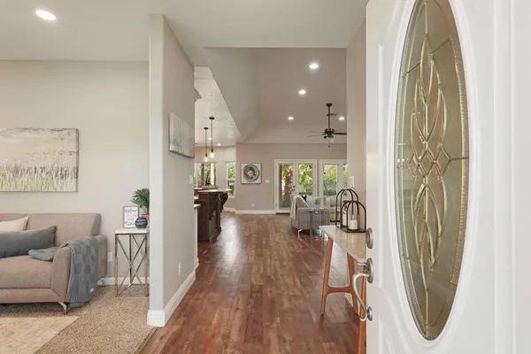 a living room with furniture and a fireplace