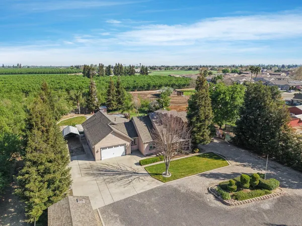 an aerial view of a house having swimming pool garden and lake view