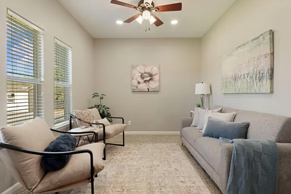 a living room with furniture and a window