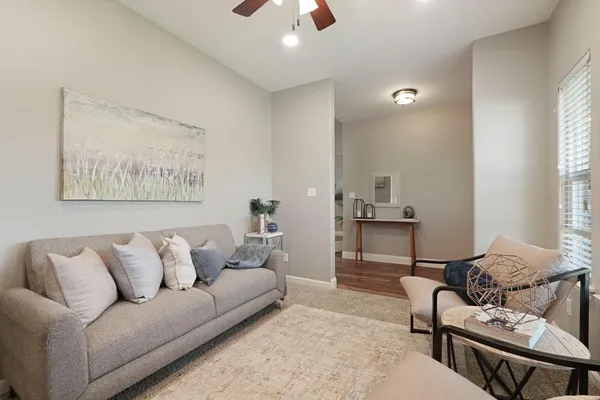 a living room with furniture and a window