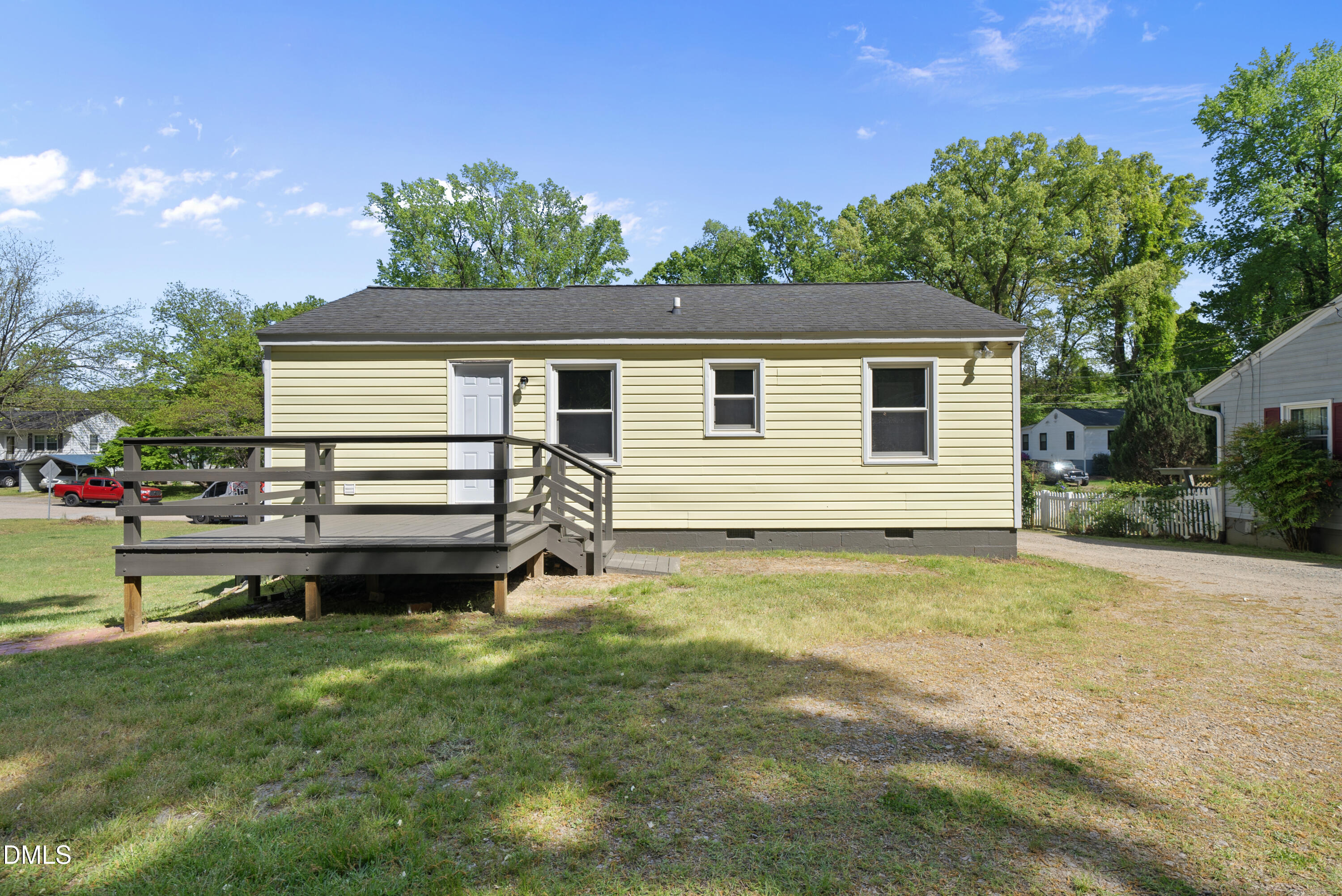2810 Newbold Street Raleigh, NC 27603 - Photo 13 of 30 a backyard of a house with a garden and deck