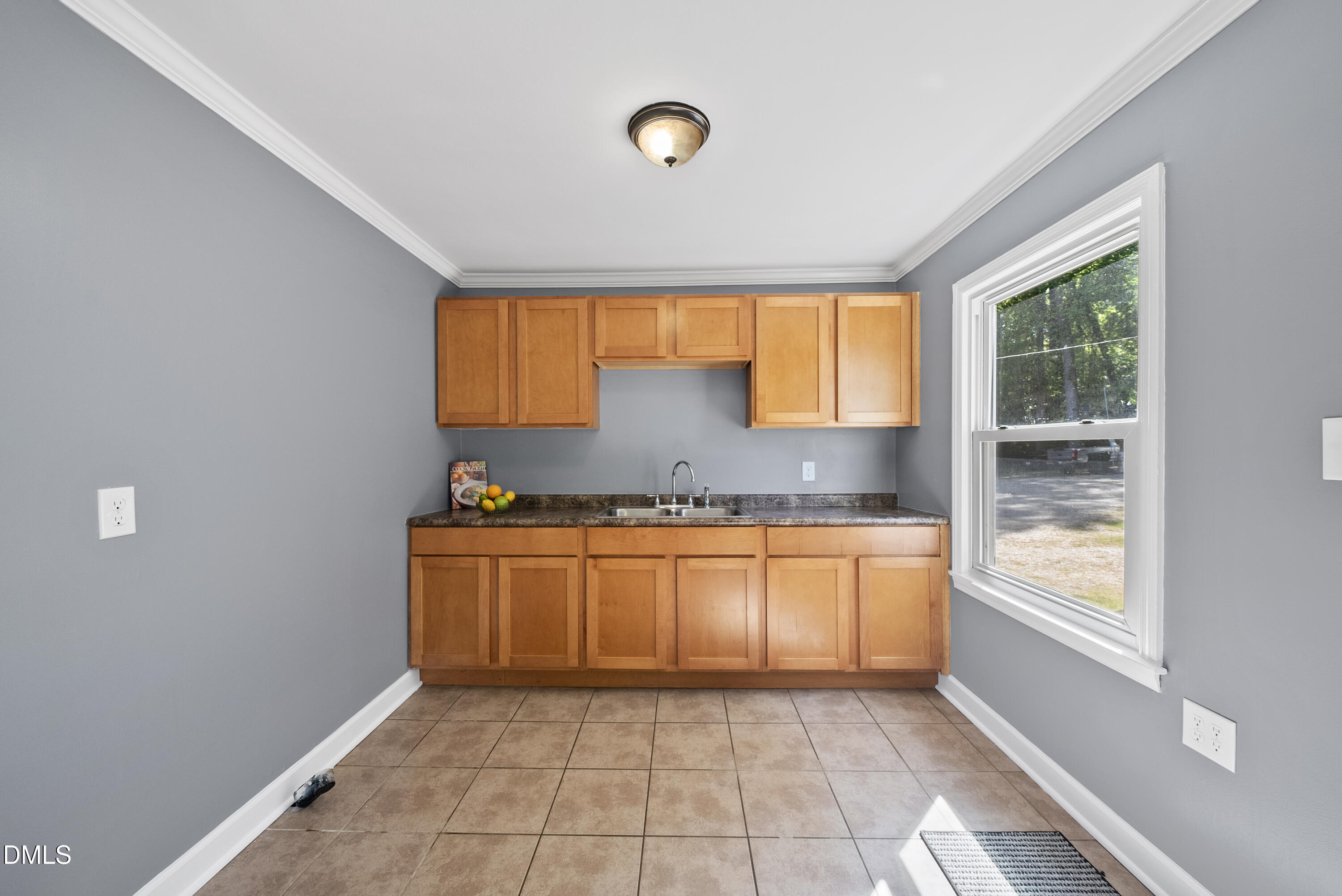 2810 Newbold Street Raleigh, NC 27603 - Photo 19 of 30 a kitchen with granite countertop a sink and a stove