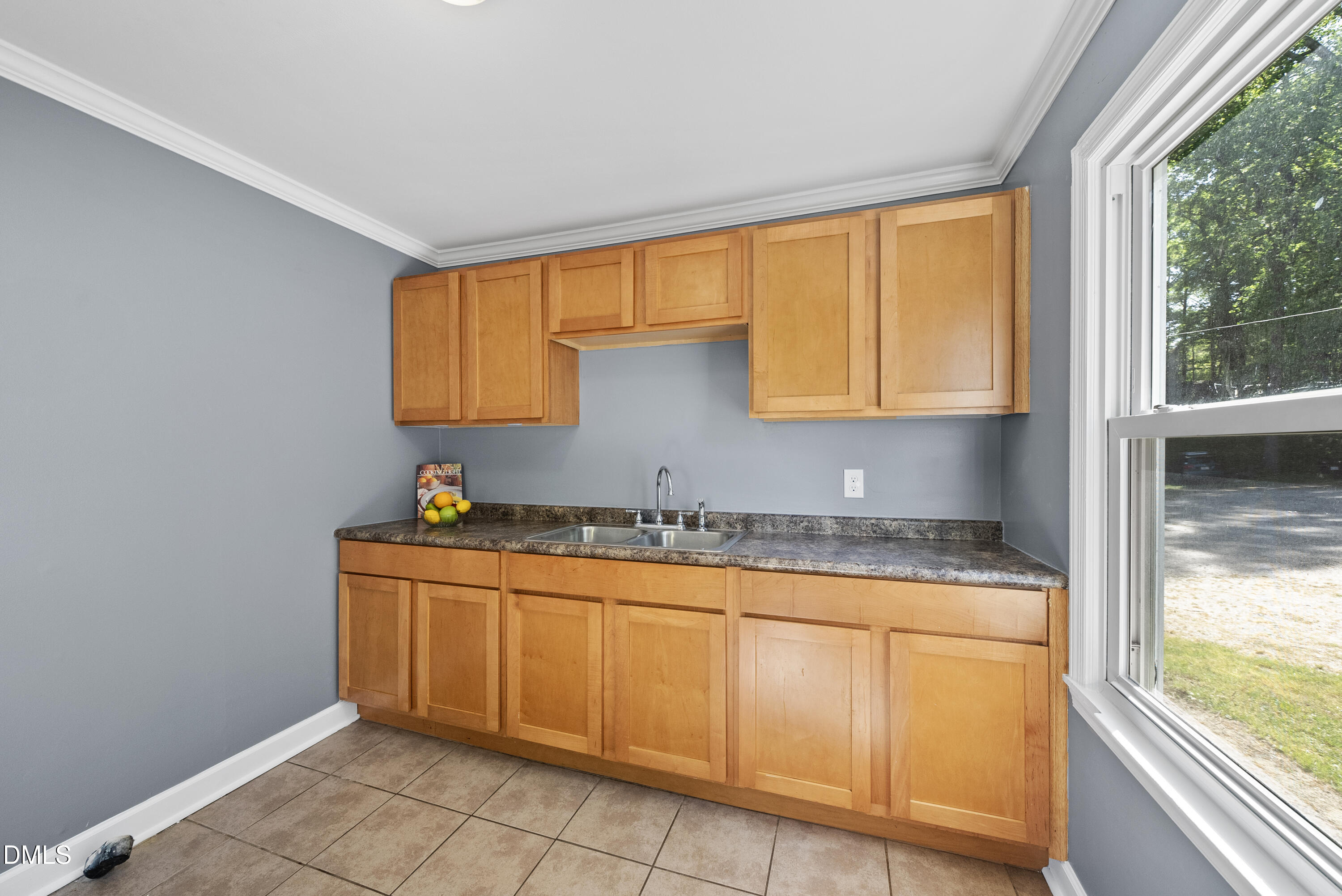 2810 Newbold Street Raleigh, NC 27603 - Photo 20 of 30 a kitchen with stainless steel appliances granite countertop a sink and a window