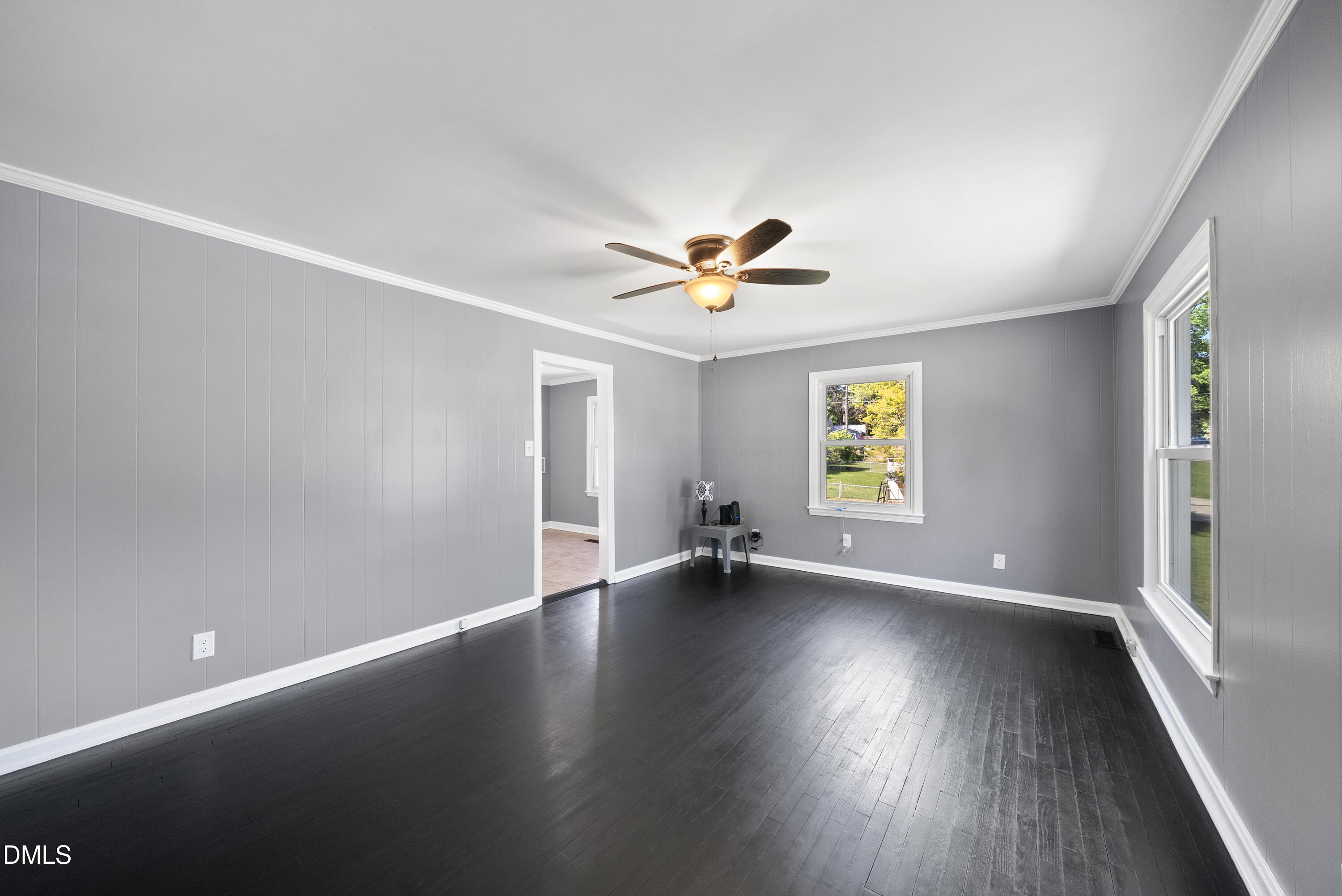 2810 Newbold Street Raleigh, NC 27603 - Photo 21 of 30 an empty room with wooden floor and windows