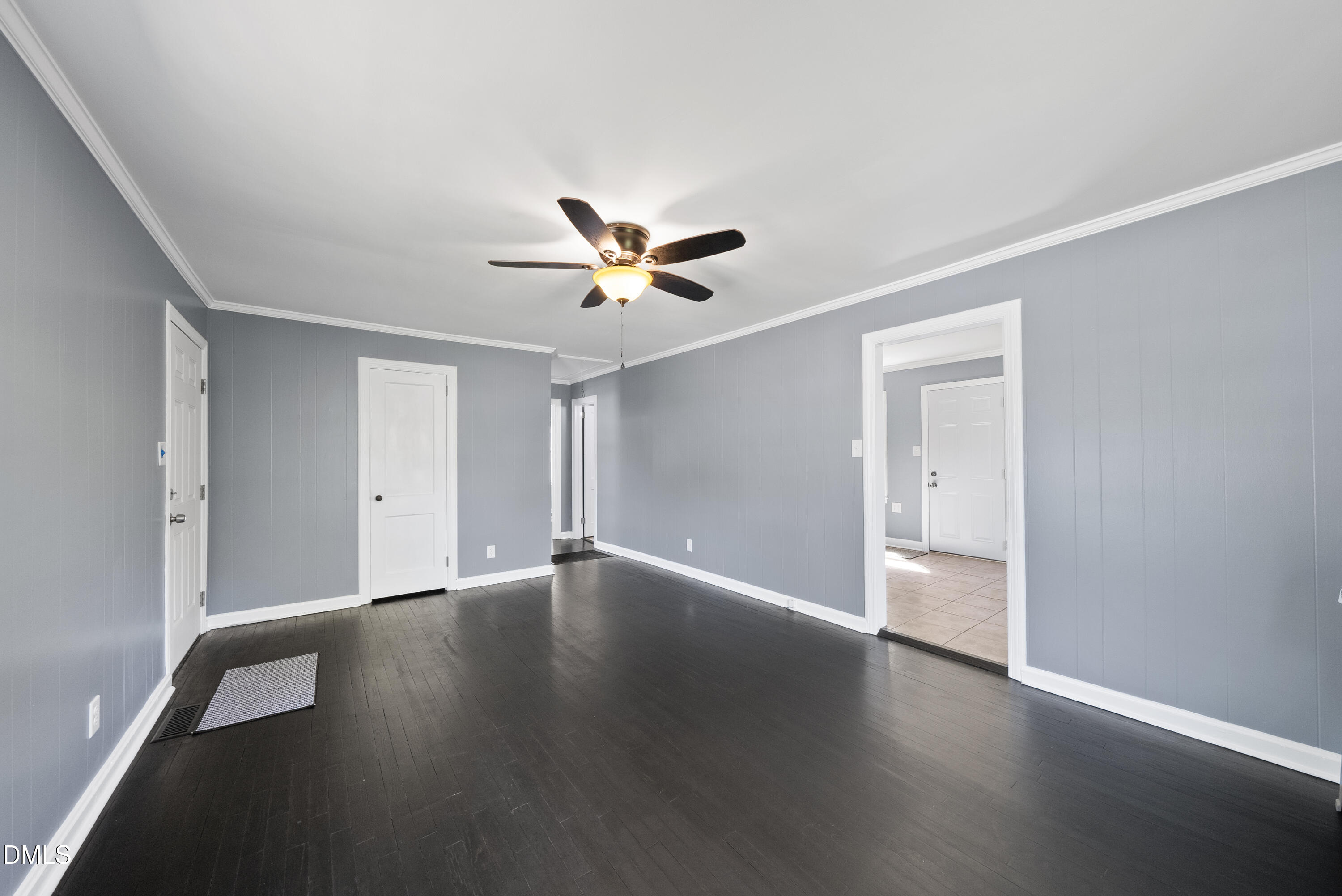 2810 Newbold Street Raleigh, NC 27603 - Photo 23 of 30 an empty room with wooden floor and a ceiling fan
