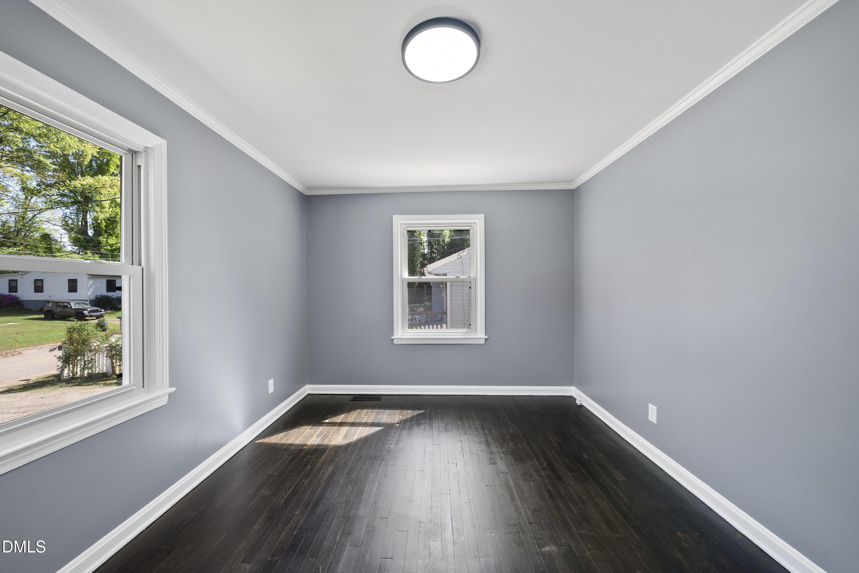 2810 Newbold Street Raleigh, NC 27603 - Photo 25 of 30 an empty room with wooden floor and windows