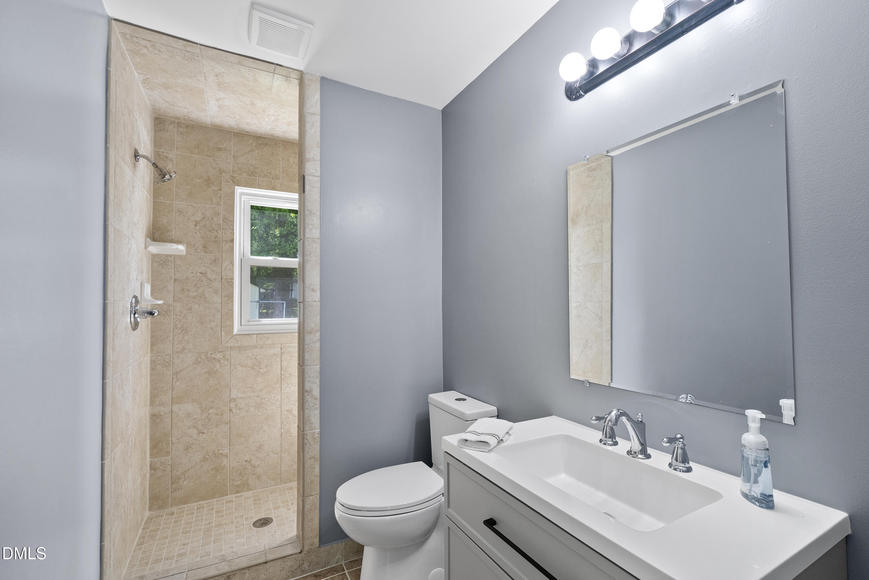 2810 Newbold Street Raleigh, NC 27603 - Photo 26 of 30 a bathroom with a sink toilet and shower