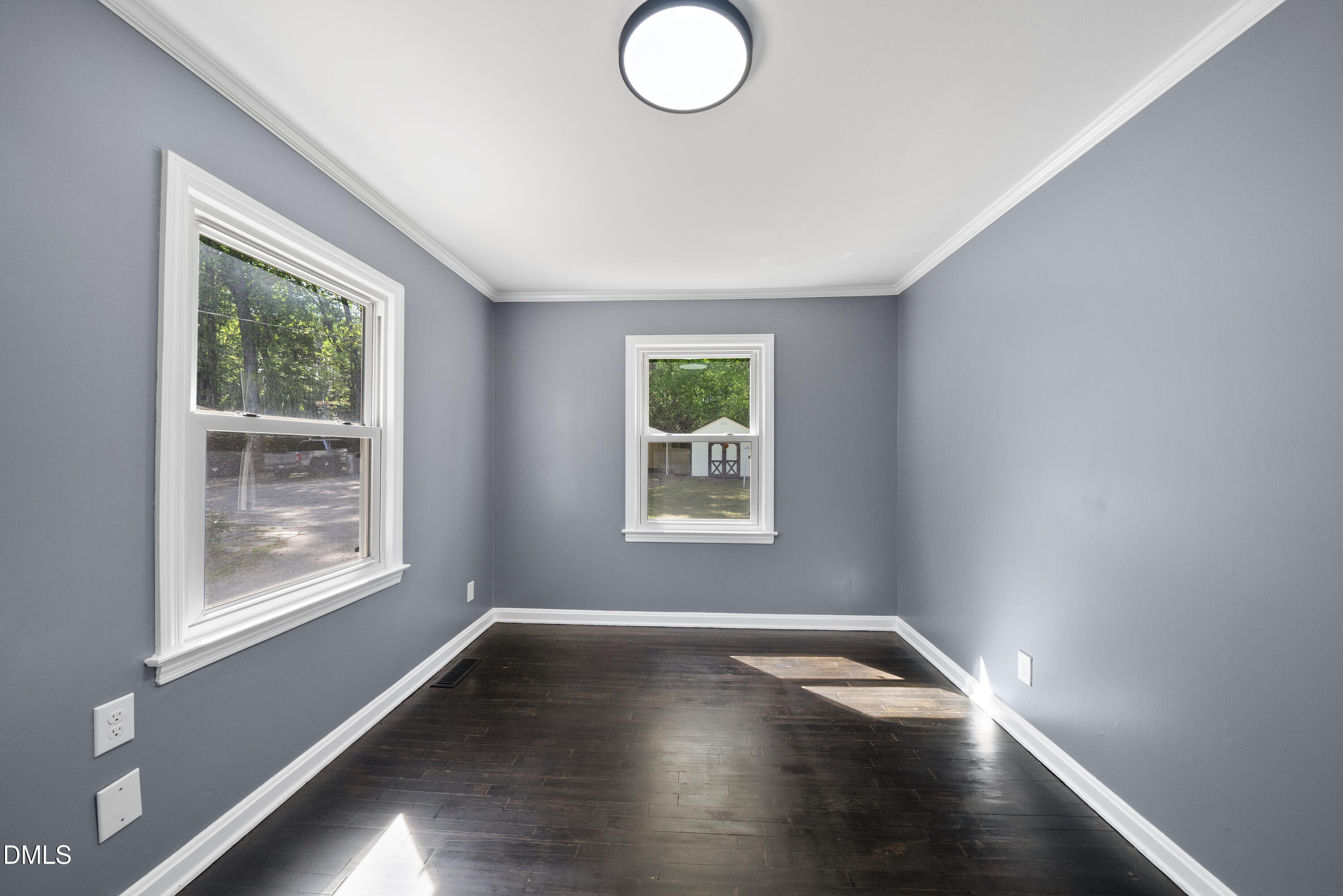 2810 Newbold Street Raleigh, NC 27603 - Photo 29 of 30 an empty room with wooden floor and windows